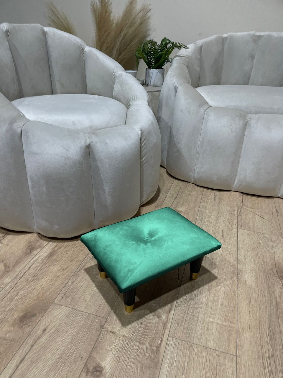 Small green footrest pouffe