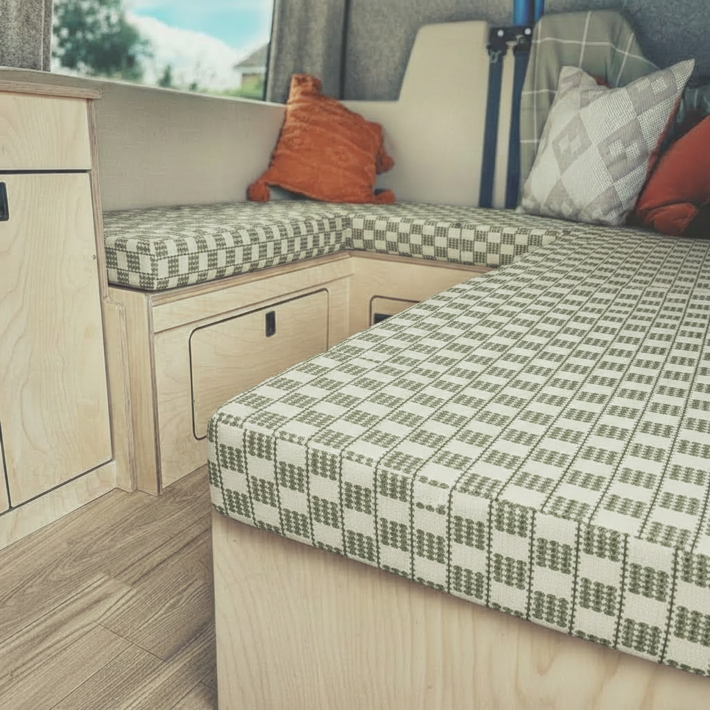 Classic sage green check Campervan cushions in cottage style interior-Traditional Farmhouse Style Upholstery on bench seating-Woven gingham plaid fabric detail for motorhomes-High density foam cushions with green and cream check-Cosy country style camper conversion seating