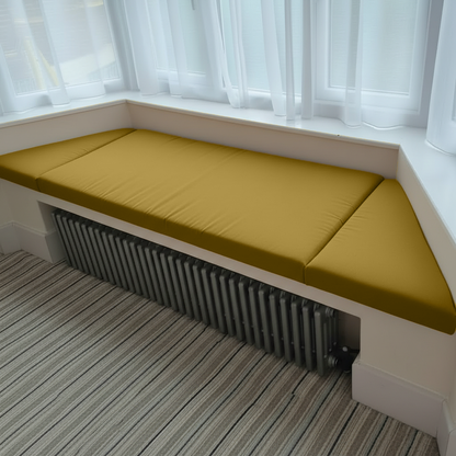Angled bay window with Mustard Gold bespoke cushions in a 3-piece set