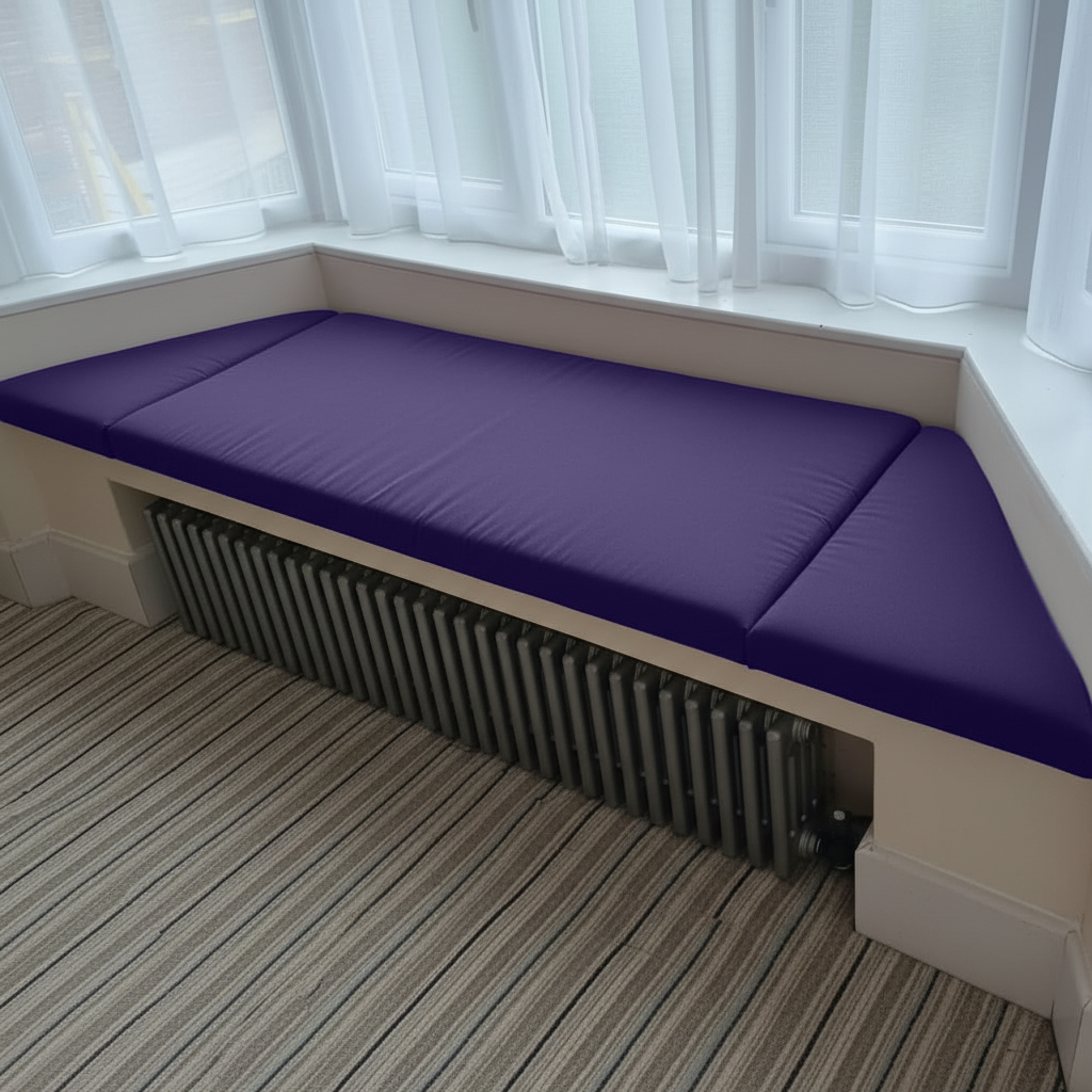 Angled bay window with bespoke purple cushions in a modern interior
