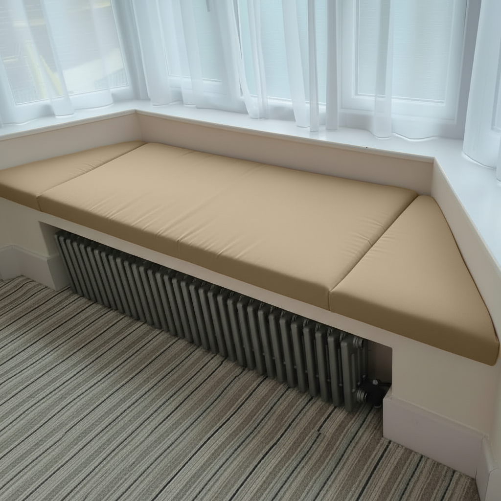 Angled bay window with champagne 3-piece bespoke cushions