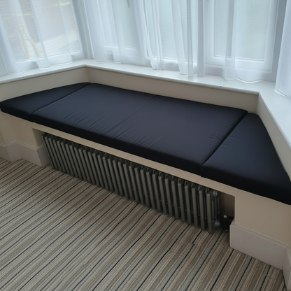 Angled bay window with luxurious black 3-piece cushions