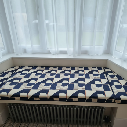 Bespoke 3-piece angled bay window cushion set installed on an indoor seating area