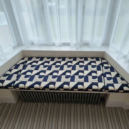 Bespoke 3-piece angled bay window cushion set installed on an indoor seating area