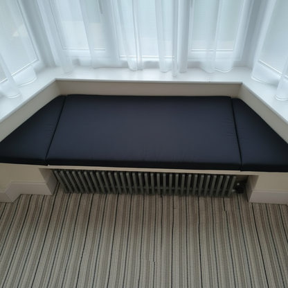 Black bespoke upholstery on trapezoid bench pads in modern interior