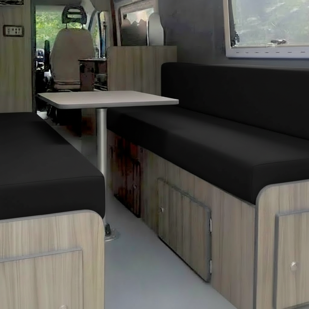 Black campervan upholstery on rock and roll bed
