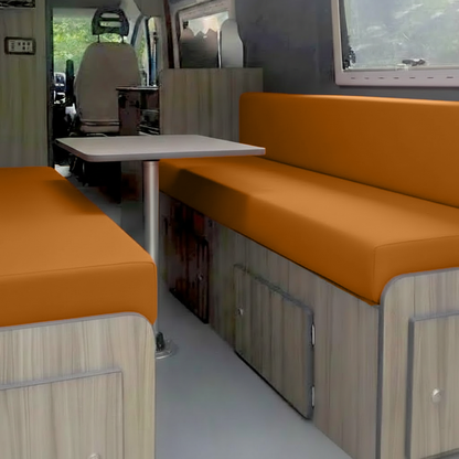 Burnt orange caravan upholstery cushion in lounge seating area

