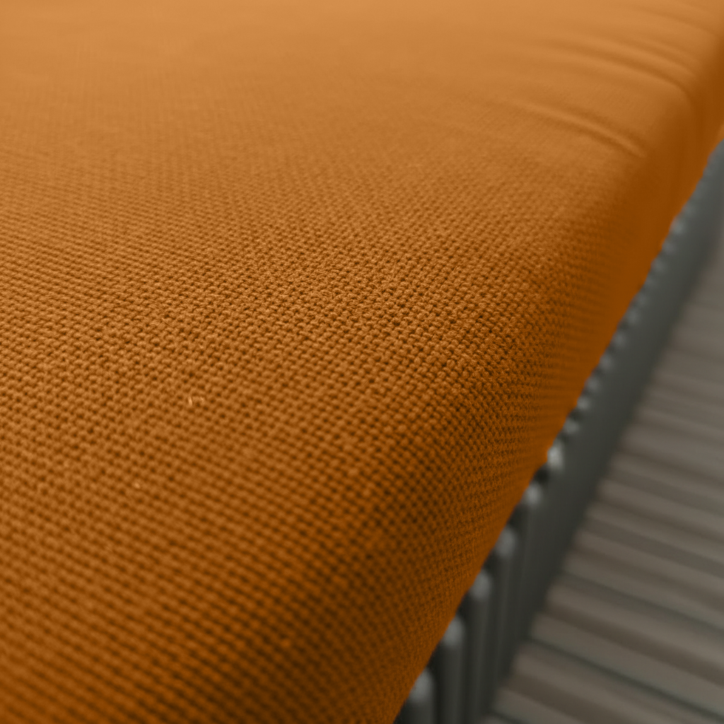 Burnt orange trapezoid bench pads styled in elegant interior
