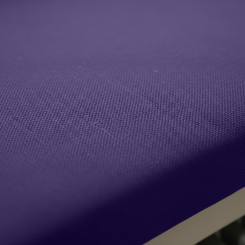 Close-up of thick foam padding and elegant piping on purple cushions