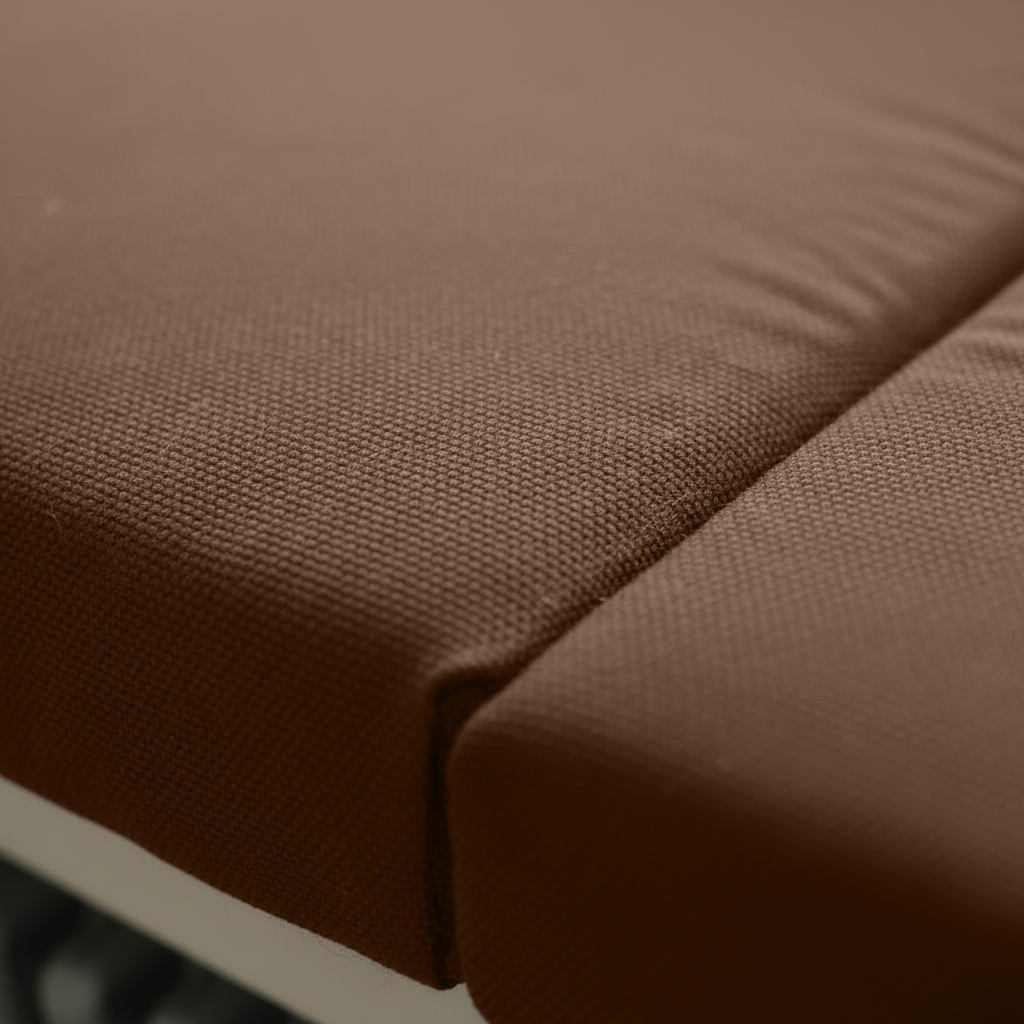 Deep brown indoor seating cushions with piping detail for bay window