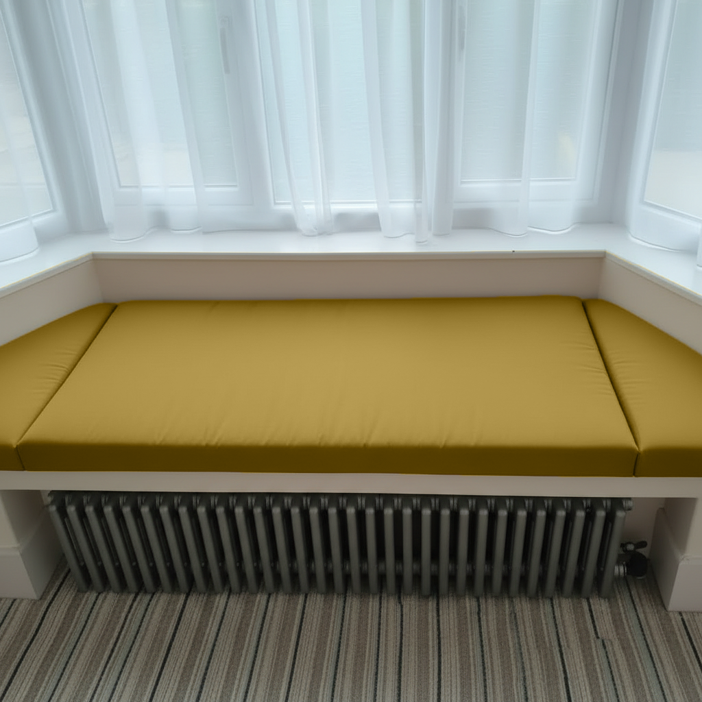 Elegant Mustard Gold cushions enhancing a reading nook