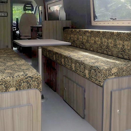Heritage dark botanical Campervan cushions in luxury interior-William Morris Style Arts & Crafts Upholstery on dining seats-Dark floral motorhome seating with gold leaf pattern-High density foam cushions for vintage caravan restoration-Moody interior design for campervan conversion
