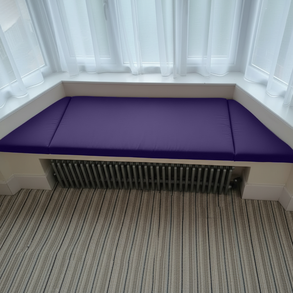 Interior design featuring purple bespoke upholstery for window seating