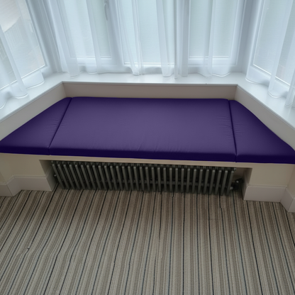 Interior design featuring purple bespoke upholstery for window seating