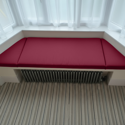 Interior design showcasing a reading nook with bespoke upholstery