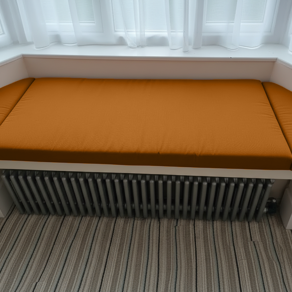 Luxury 3 piece bay window seat cushion set in burnt orange fabric
