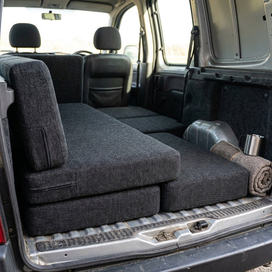 Modular foam cushion system for Citroen Berlingo camper conversion providing tailored sleeping surface with UK handmade craftsmanship