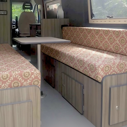 Premium campervan cushion seating with dusty pink geometric floral pattern on dinette benches
