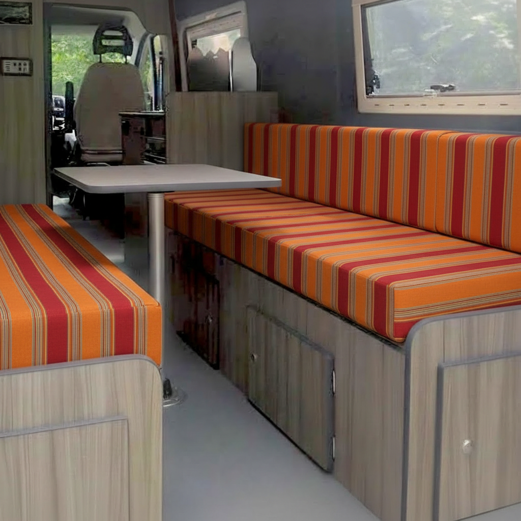 Premium campervan cushion seating with orange and red striped fabric on dinette benches
