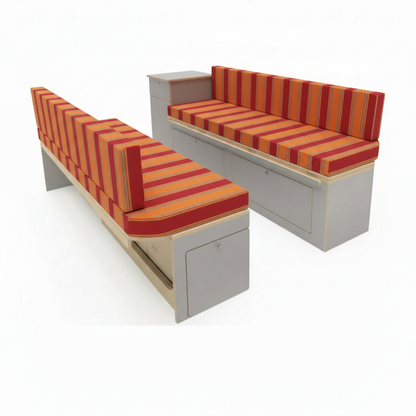 Premium campervan cushion seating with orange and red striped fabric on dinette benches
