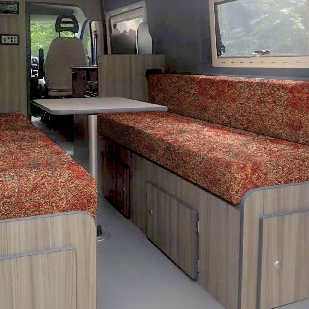 Premium motorhome cushion seating in traditional rust tapestry fabric inside a van conversion

