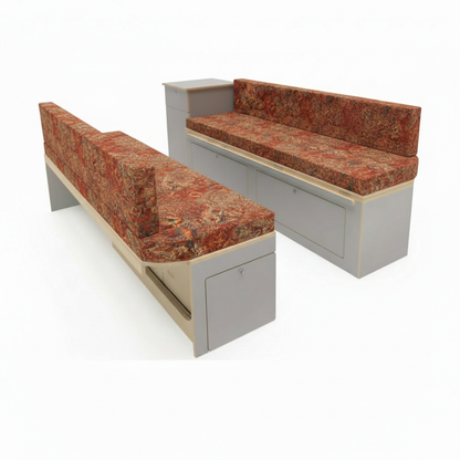Premium motorhome cushion seating in traditional rust tapestry fabric inside a van conversion
