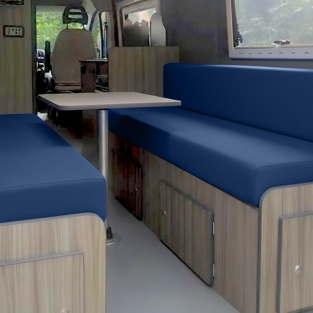 Royal blue velvet campervan cushion seating area with table