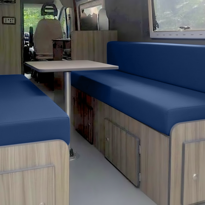 Royal blue velvet campervan cushion seating area with table