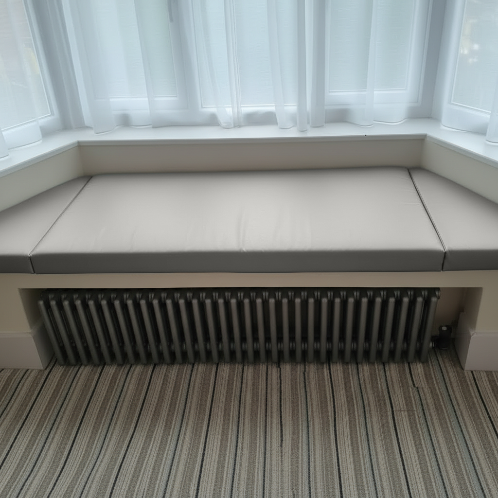 Trapezoid bench pads in silver fabric for indoor seating area