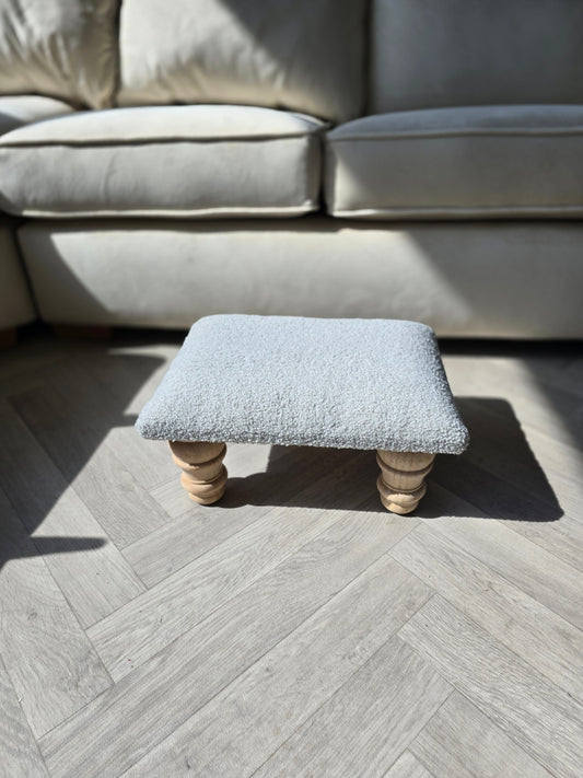 Silver boucle footrest pouffe